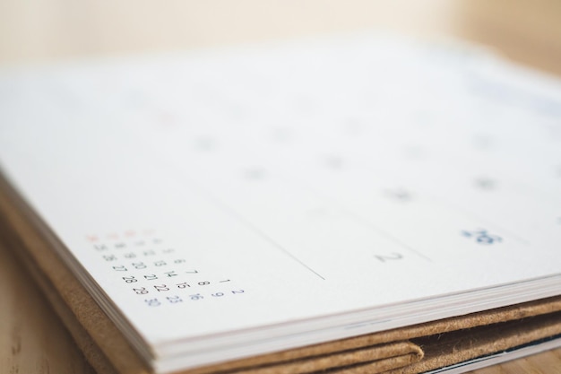 Calendar page on wood table background