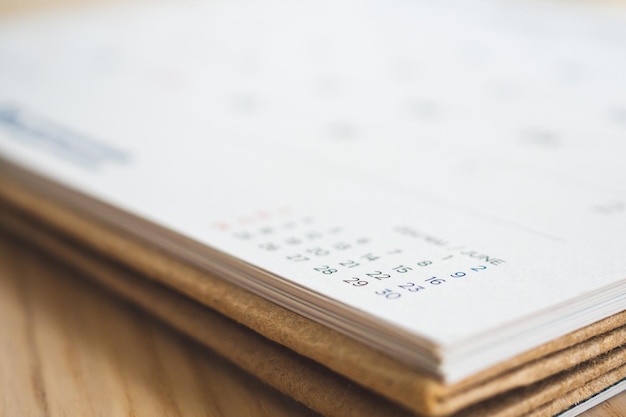 Calendar page on wood table background