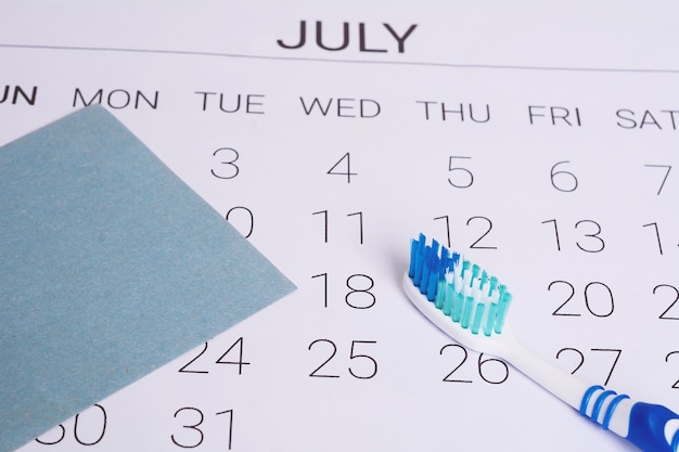 Calendar and toothbrush. 