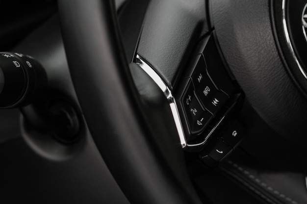 Call buttons on car steering wheel Audio control buttons on the steering wheel of a modern car