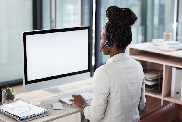 Call center computer screen and mockup with black woman in office for consulting customer service and help desk Communication contact us and website with back of employee for kpi and networking