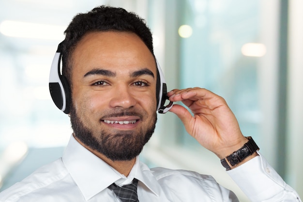 Call center operator man with headsets working