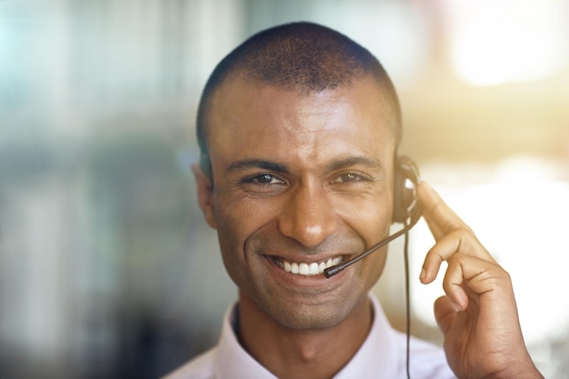 Call center portrait and happy man in virtual communication business support and e commerce helping Face of IT agent advisor or african person smile for telecom customer service or client advice