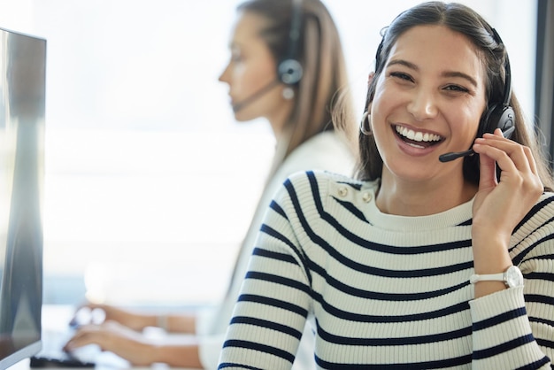 Call center portrait and woman with headset in office for communication customer support or service Contact us CRM and friendly consultant at desk for counselling immigration aid or legal advice