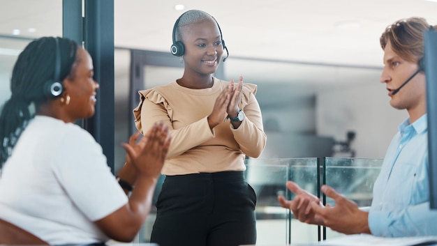 Call center support team clapping hands in congratulations and celebration for achievement and success Happy telemarketing and customer service people in diversity happiness and excited for leader