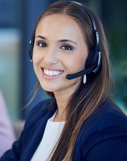 Call center telemarketing and portrait of a woman consultant offering contact us advice Customer support customer service and female professional sales operator in an advisory agency at help desk