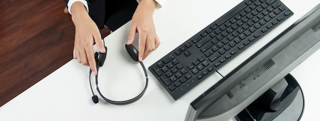 Photo call center wearing headset working in office for customer support oratory