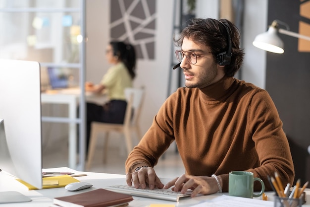 Call centre operator working on computer