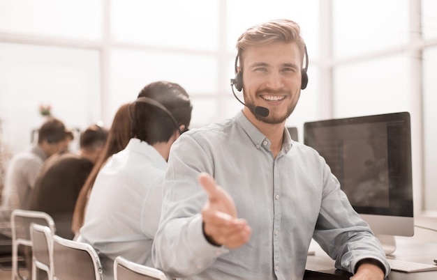 Call operator stretching out his hand for a handshake photo with copy space