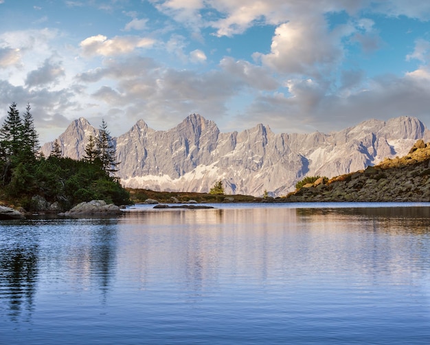 Calm autumn Alps mountain lake with clear transparent water and reflections Spiegelsee or Mittersee or Mirror Lake Reiteralm Steiermark Austria