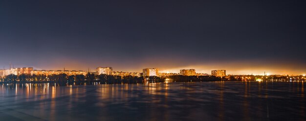 Calm big beautiful Dnieper river in the huge night bright city of Dnipropetrovsk in wonderful Ukraine