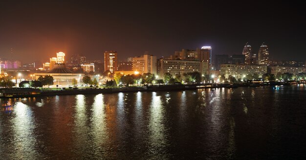 Calm big beautiful Dnieper river in the huge night bright city of Dnipropetrovsk in wonderful Ukraine