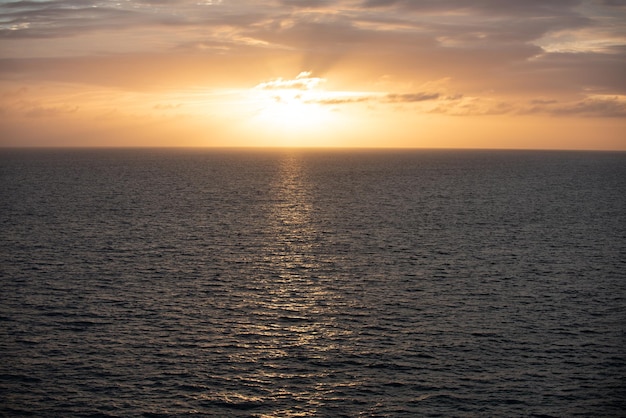 Calm ocean water Golden sunset at the sea landscape with sunset over the ocean