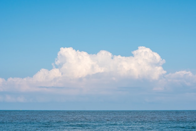 Calm Sea, Black Sea and white clouds on a Blue Sky. Nature