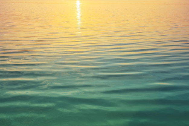 Calm sea surface at sunset