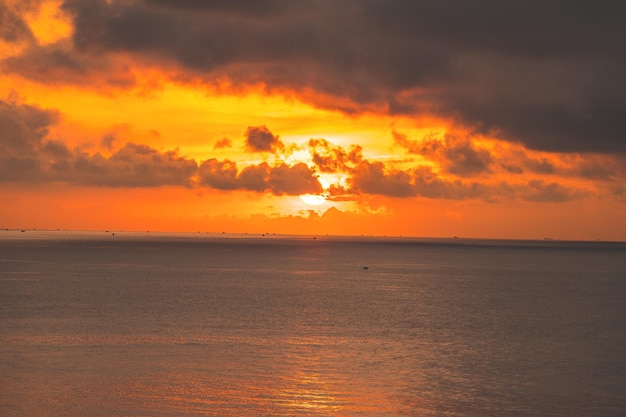 Calm sea with sunset sky and sun through the clouds over Calm sea with sunset sky and sun through the clouds over Meditation ocean and sky background Tranquil seascape Horizon over the water