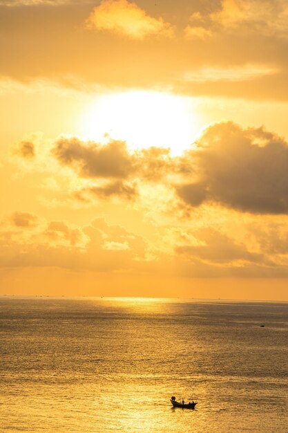 Calm sea with sunset sky and sun through the clouds over Calm sea with sunset sky and sun through the clouds over Meditation ocean and sky background Tranquil seascape Horizon over the water