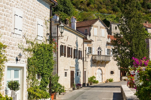 Calm street a part of a promenade of popular resort town Perast Montenegro