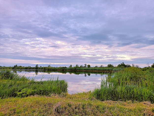 Calm water on lake Storm Rainy weather Summer overcast sky Dramatic landscape cloudy day