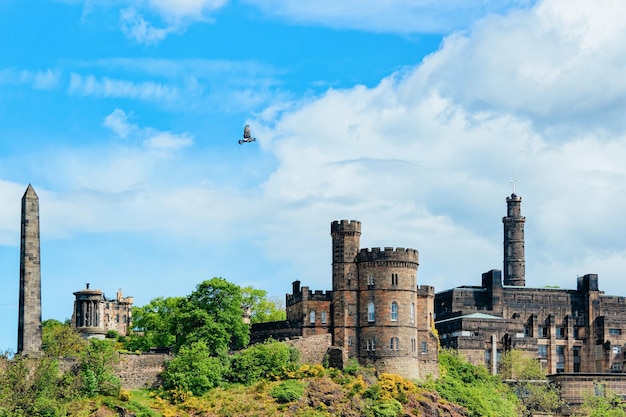 Calton Hill with Political Martyrs Monument on Old Calton Burial Ground, Dugald Stewart Monument, Saint Andrew House and tower of Nelson Monument in Edinburgh Castle in Scotland in the UK.