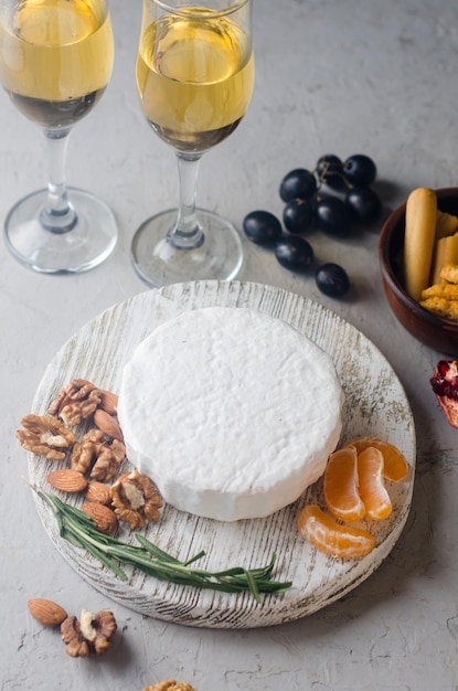 Camembert cheese with white mold walnuts and honey