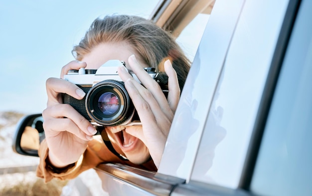 Camera car and road trip of a woman excited about holiday adventure and motor travel transport Photography of a happy person in transportation ready for vehicle traveling and summer vacation