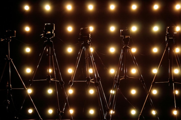 Photo cameras in illuminated room