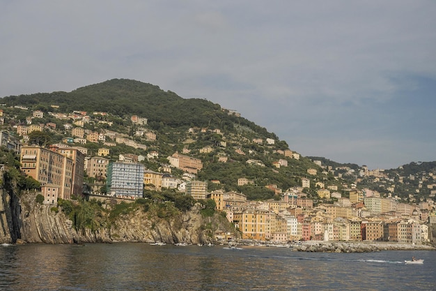 Camogli typical village with colorful houses and small harbor in Italy, Liguria in a sunny day view from the boat