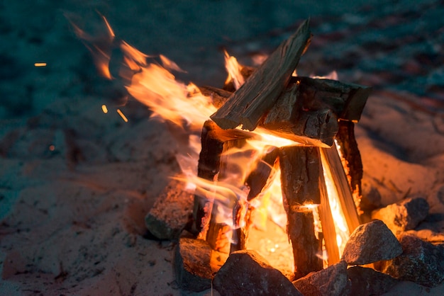 Camping fire burning at night