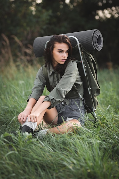 Camping with tents Sexy young girl travels with a backpack