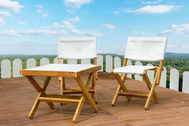 Camping wood chair set on the nature mountain and sky background