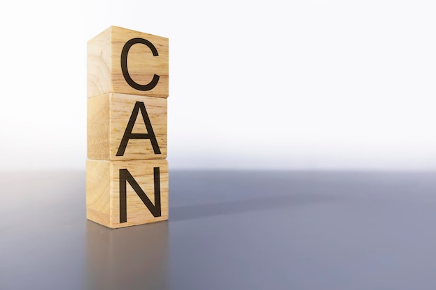 CAN letters on a wooden boxencouragement psychologyability to achieve goals