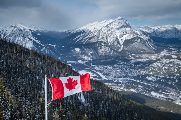 Canada Flag and Beautiful mountain landscape