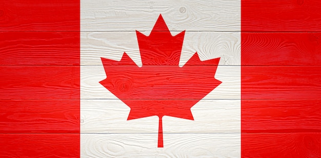 Canada flag painted on old wood plank background