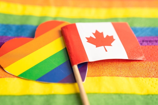 Canada flag on rainbow background symbol of LGBT gay pride month social movement rainbow flag is a symbol of lesbian gay bisexual transgender human rights tolerance and peace