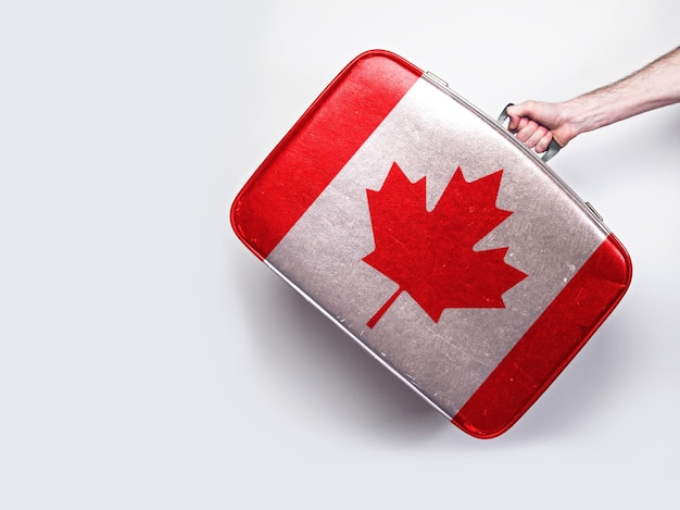 Canada flag on a vintage leather suitcase