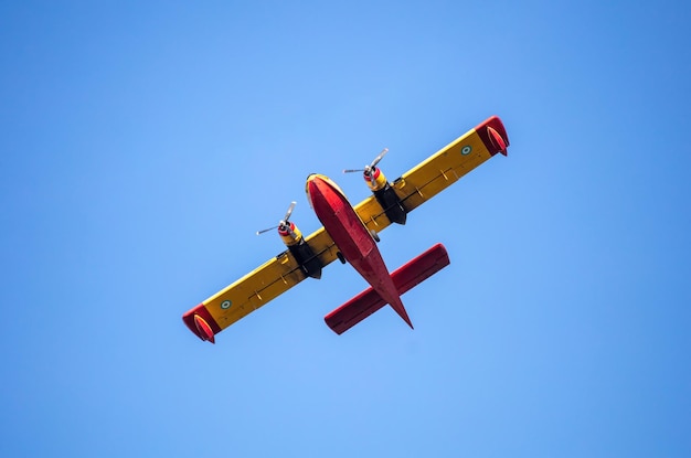 Canadair flight Firefight Aircraft scooper flying on blue sky under view