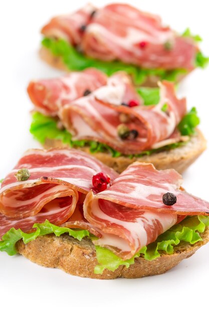 Canape with bacon isolated on white background