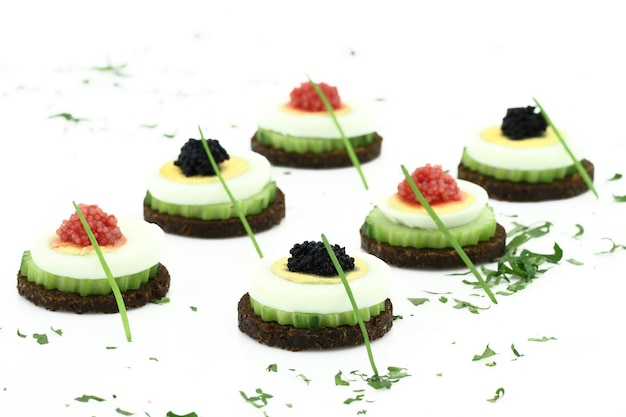 Canape with cucumber egg and caviar