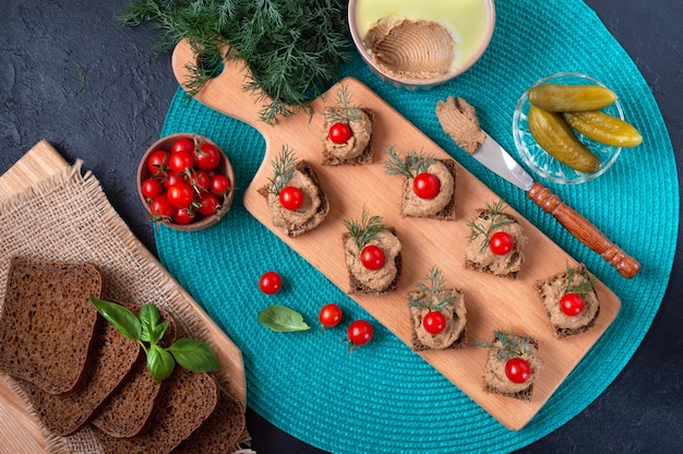 Canapes with rye bread liver pate cherry tomatoes Breakfast snack Top view