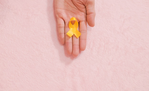 Cancer awareness hand ribbon top view