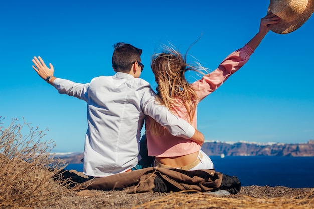 candiCouple in love enjoying sea landscape on honeymoon