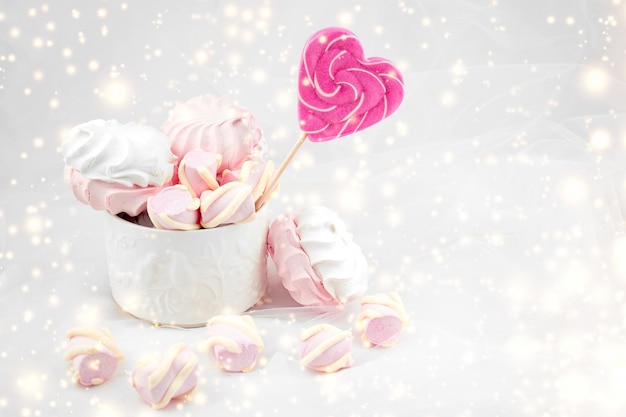 Candies and sweets on a white background Lollipop heart and love Sweets are harmful to teeth