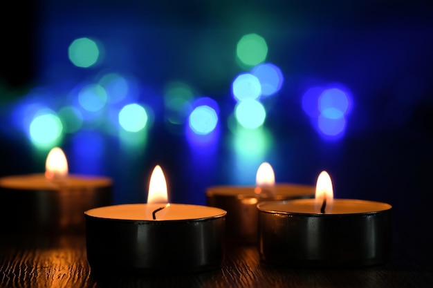 Candle light and bokeh background in the darkness with space for text or image