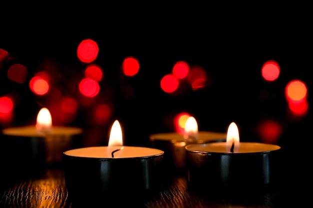 Candle light and bokeh background in the darkness with space for text or image