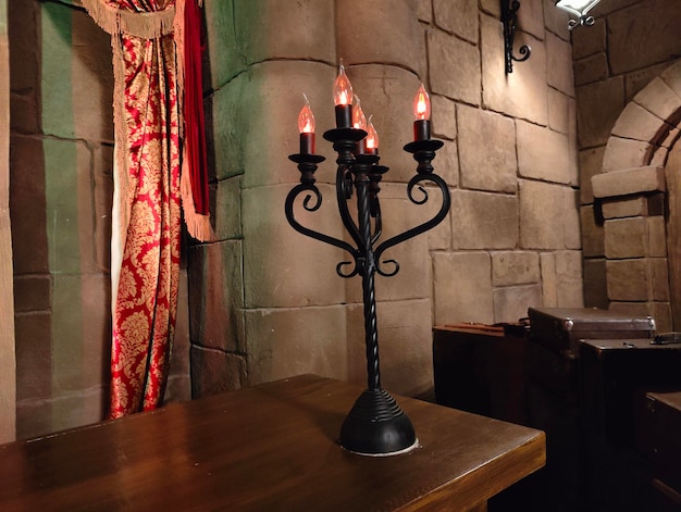 Candle in old castle. Burning candles on a dark background. Halloween concept.