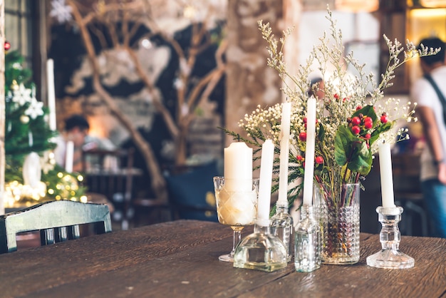 candle and vase decoration on table in cafe restaurant