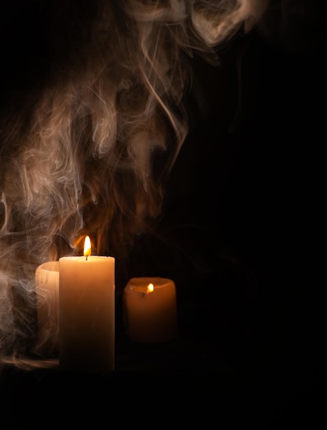 Candles beautiful candles positioned on dark surface black background selective focus