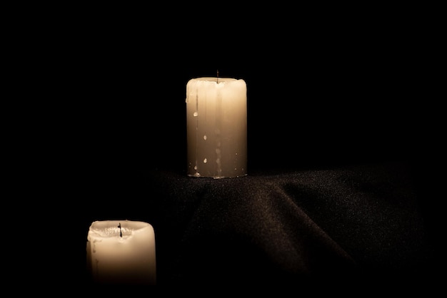 Candles beautiful candles positioned on dark surface black background selective focus