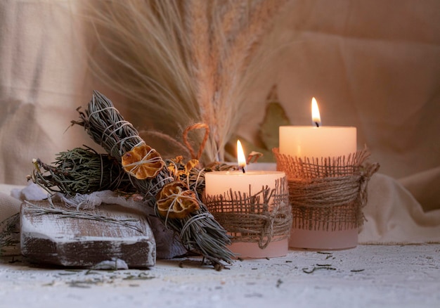 Candles in front of a window with a candle in the background